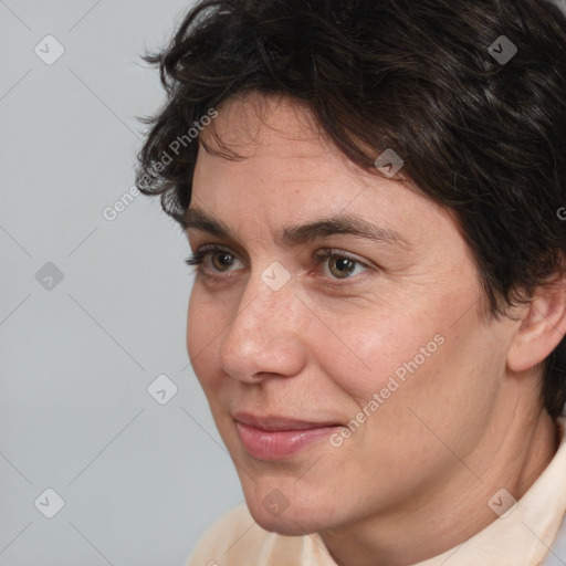 Joyful white adult female with short  brown hair and brown eyes