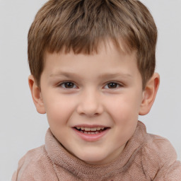 Joyful white child male with short  brown hair and brown eyes