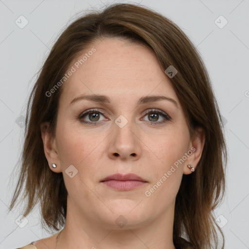 Joyful white adult female with medium  brown hair and grey eyes