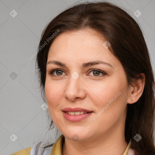 Joyful white adult female with medium  brown hair and brown eyes