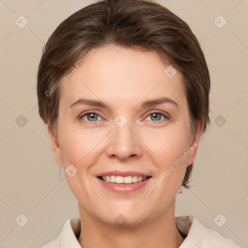 Joyful white young-adult female with short  brown hair and grey eyes