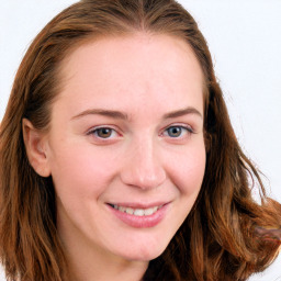 Joyful white young-adult female with long  brown hair and blue eyes