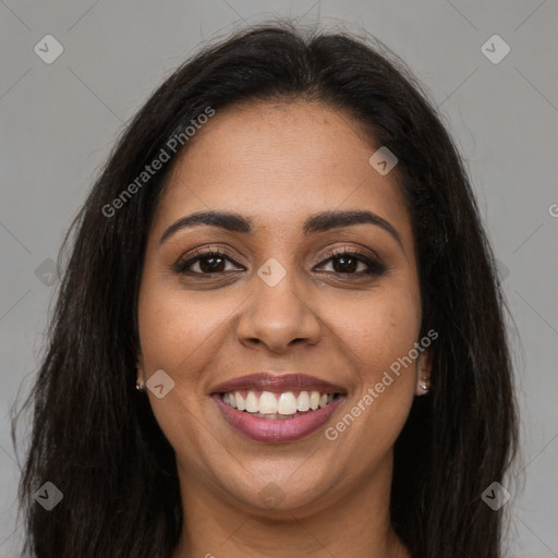 Joyful latino young-adult female with long  brown hair and brown eyes