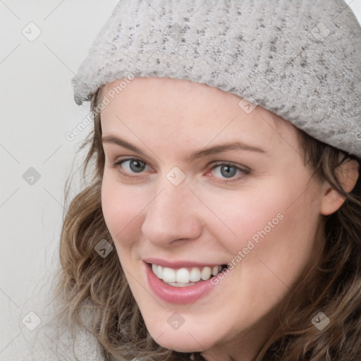 Joyful white young-adult female with medium  brown hair and blue eyes