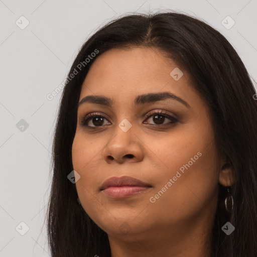 Joyful latino young-adult female with long  brown hair and brown eyes