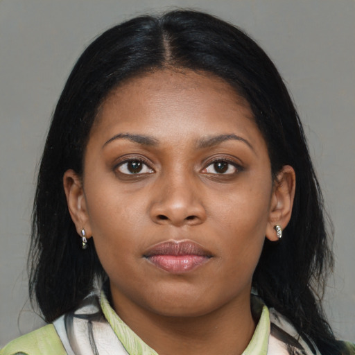 Neutral black young-adult female with medium  brown hair and brown eyes
