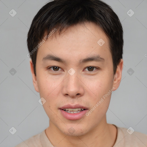 Joyful asian young-adult male with short  brown hair and brown eyes