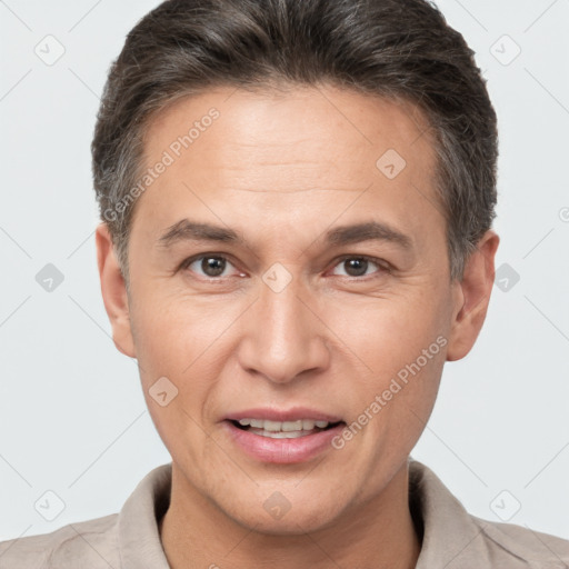 Joyful white adult male with short  brown hair and brown eyes