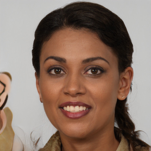 Joyful black young-adult female with medium  brown hair and brown eyes