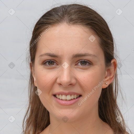 Joyful white young-adult female with long  brown hair and grey eyes