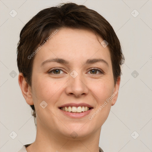 Joyful white young-adult female with short  brown hair and grey eyes