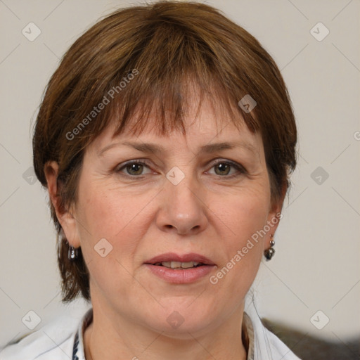 Joyful white adult female with medium  brown hair and grey eyes