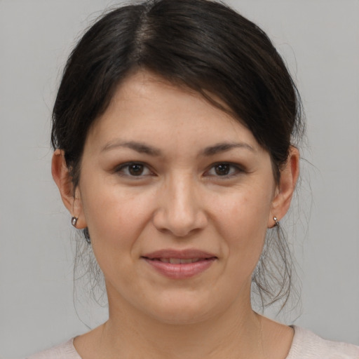 Joyful white young-adult female with medium  brown hair and brown eyes