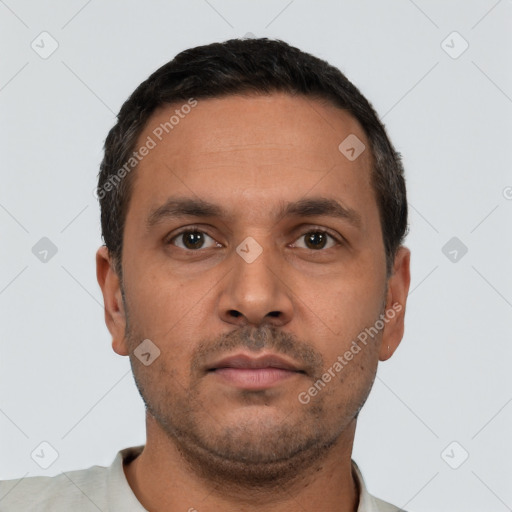 Neutral white young-adult male with short  black hair and brown eyes