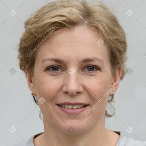 Joyful white adult female with medium  brown hair and grey eyes