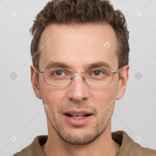 Joyful white adult male with short  brown hair and grey eyes