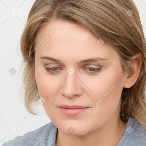 Joyful white young-adult female with medium  brown hair and blue eyes