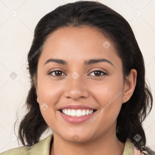 Joyful latino young-adult female with medium  brown hair and brown eyes