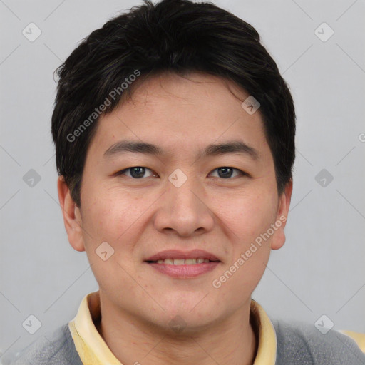 Joyful asian young-adult male with short  brown hair and brown eyes