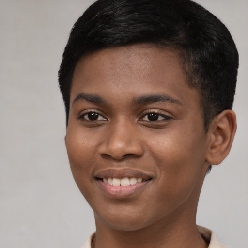Joyful black young-adult male with short  black hair and brown eyes