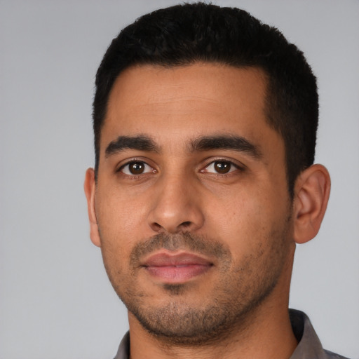 Neutral latino young-adult male with short  black hair and brown eyes