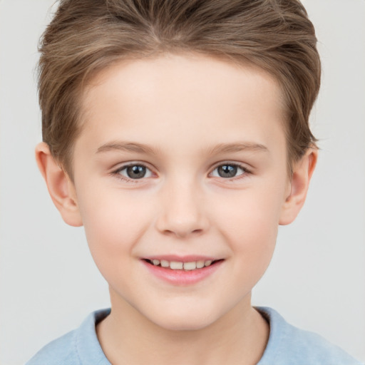 Joyful white child female with short  brown hair and brown eyes