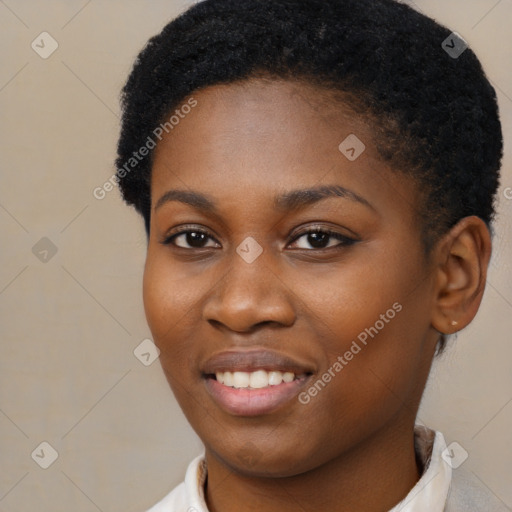 Joyful black young-adult female with short  brown hair and brown eyes