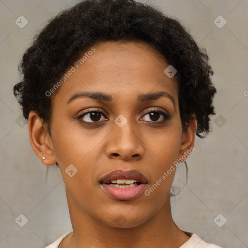 Joyful black young-adult female with short  brown hair and brown eyes