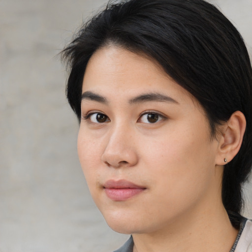 Neutral asian young-adult female with medium  brown hair and brown eyes