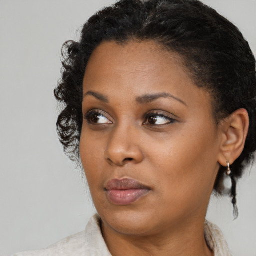 Neutral black young-adult female with medium  black hair and brown eyes