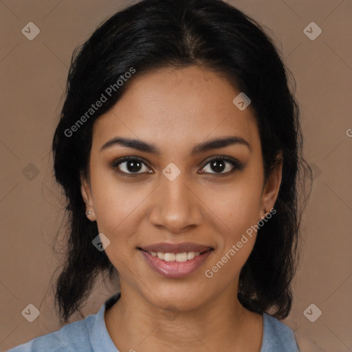 Joyful black young-adult female with medium  black hair and brown eyes