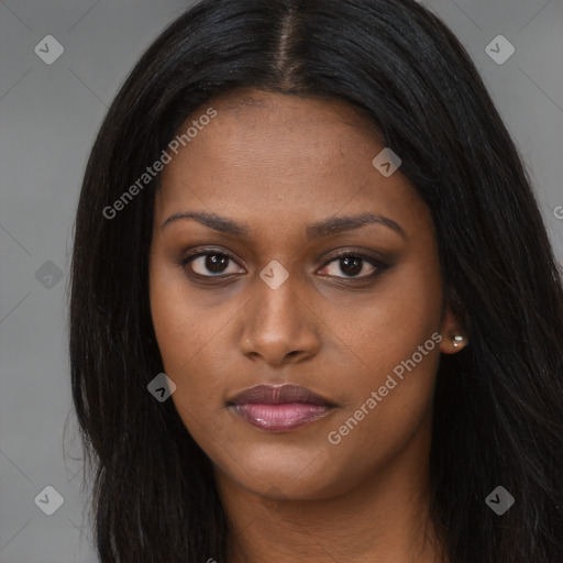 Joyful black young-adult female with long  brown hair and brown eyes