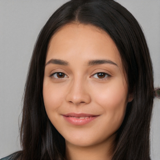 Joyful white young-adult female with long  black hair and brown eyes