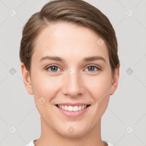 Joyful white young-adult female with short  brown hair and grey eyes