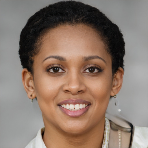 Joyful latino young-adult female with short  brown hair and brown eyes