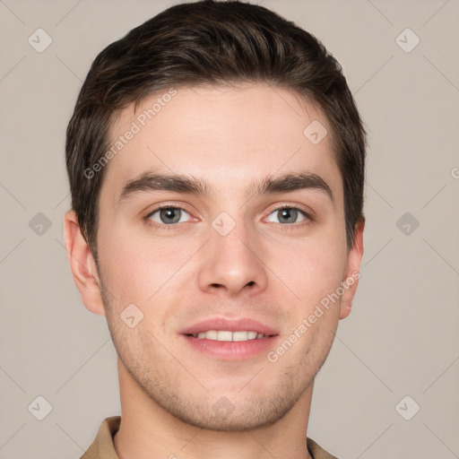 Joyful white young-adult male with short  brown hair and grey eyes