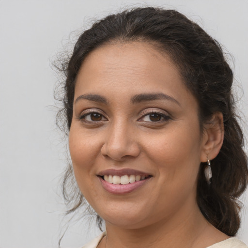 Joyful white young-adult female with medium  brown hair and brown eyes