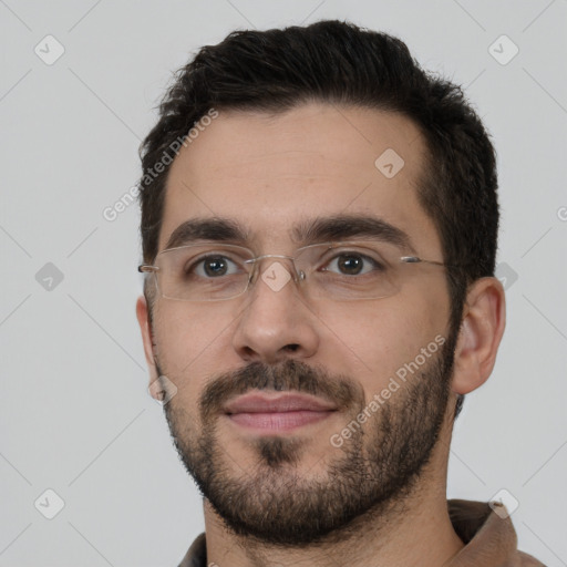 Neutral white young-adult male with short  black hair and brown eyes