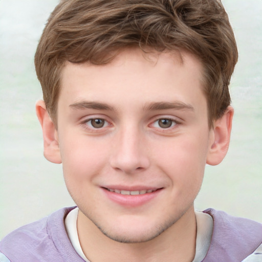 Joyful white child male with short  brown hair and grey eyes