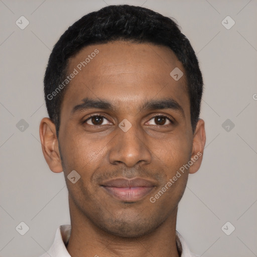 Joyful black young-adult male with short  black hair and brown eyes