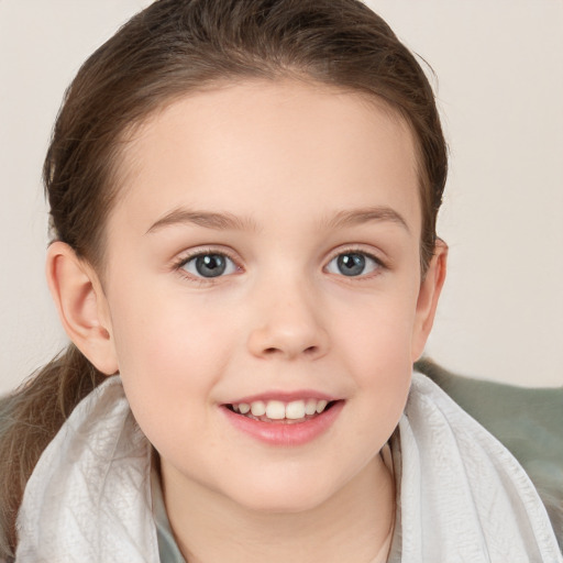 Joyful white child female with medium  brown hair and brown eyes