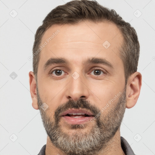 Joyful white adult male with short  brown hair and brown eyes