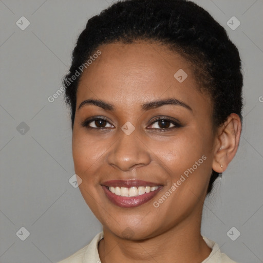 Joyful black young-adult female with short  brown hair and brown eyes