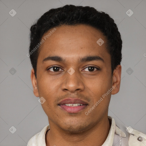 Joyful black young-adult male with short  black hair and brown eyes