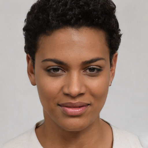 Joyful latino young-adult female with short  brown hair and brown eyes