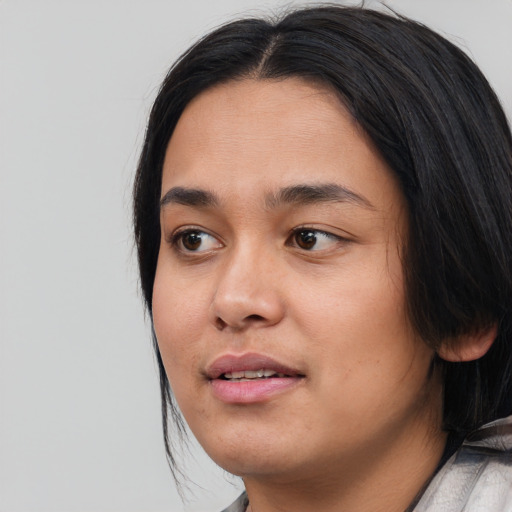 Neutral asian young-adult female with medium  black hair and brown eyes