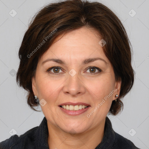 Joyful white adult female with medium  brown hair and brown eyes