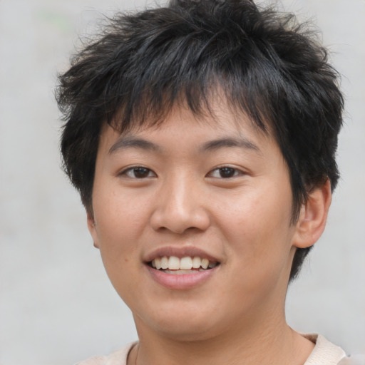 Joyful asian young-adult female with short  brown hair and brown eyes