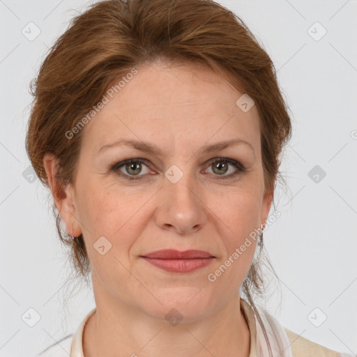 Joyful white adult female with medium  brown hair and grey eyes