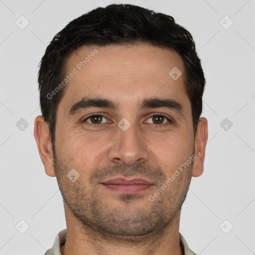 Joyful white young-adult male with short  black hair and brown eyes